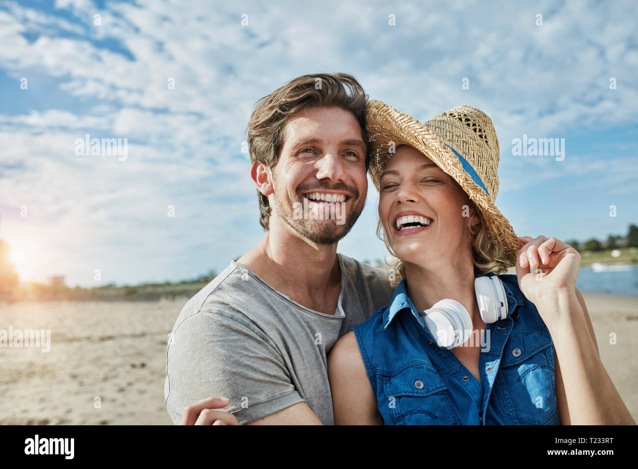 Happy young couple on the beach Stock Photo