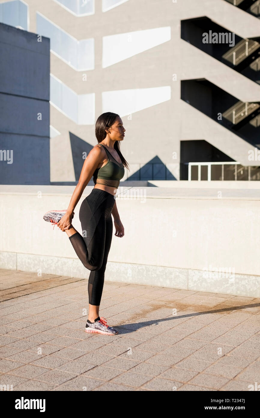 Woman doing stretching exercise hi-res stock photography and images - Alamy