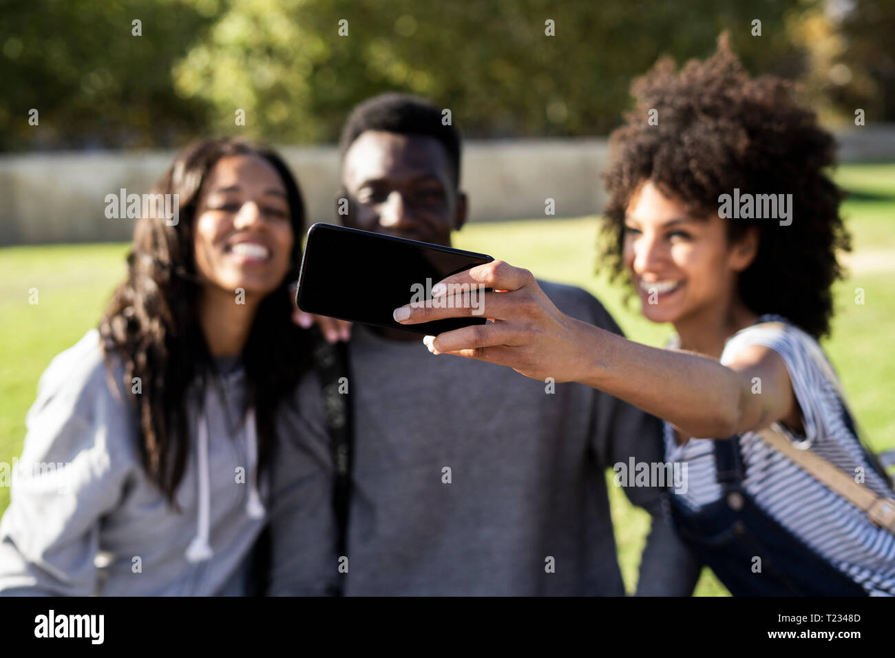 Three friends spending time in the city Stock Photo