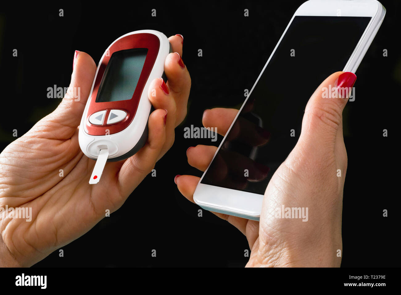 Portable healthcare technology. Blood sugar test kit combined with smart phone. Stock Photo