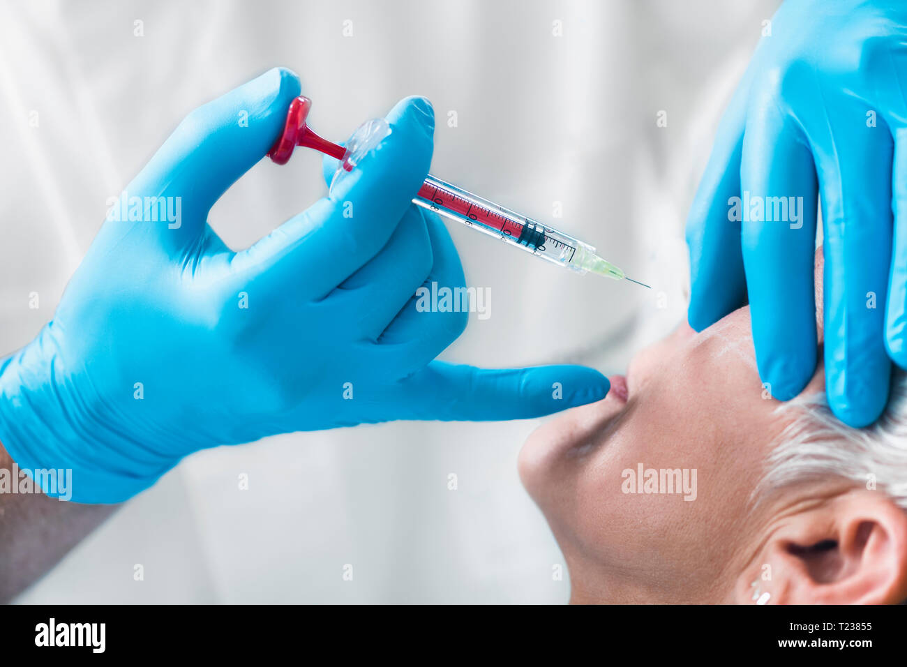 Hyaluronic acid injections. Mature woman receives hyaluronic acid