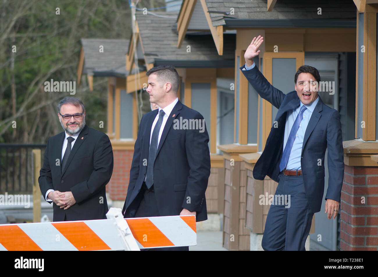 Canadian Prime Minister Justin Trudeau (waving) and Dan Ruimy, Ridge/Meadows MP representative in the House of Commons (left). Security in center. Stock Photo