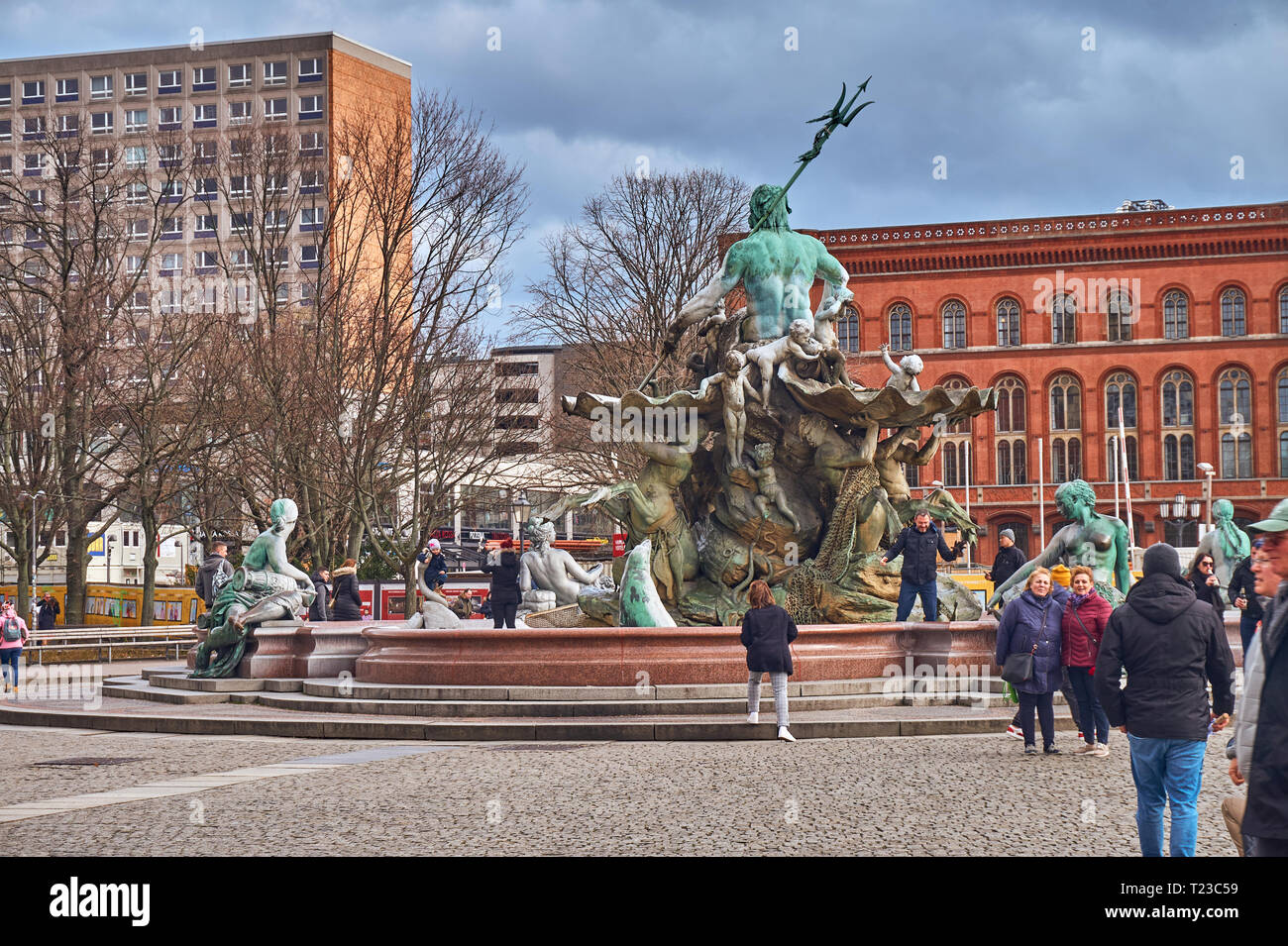 The antique Neptune Fountain built in 1891 designed by Reinhold Begas in a cold end of winter day in Berlin, Germany Stock Photo