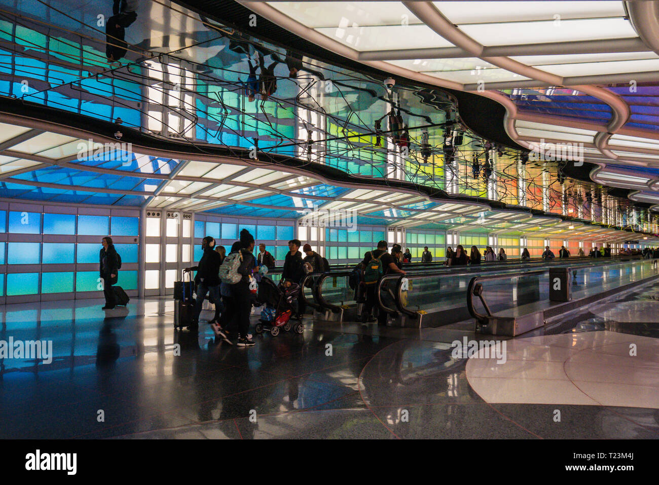 chicago ohare airport underground tunnel connecting concourses with neon lighting decoration by canadian artist micael hayden Stock Photo