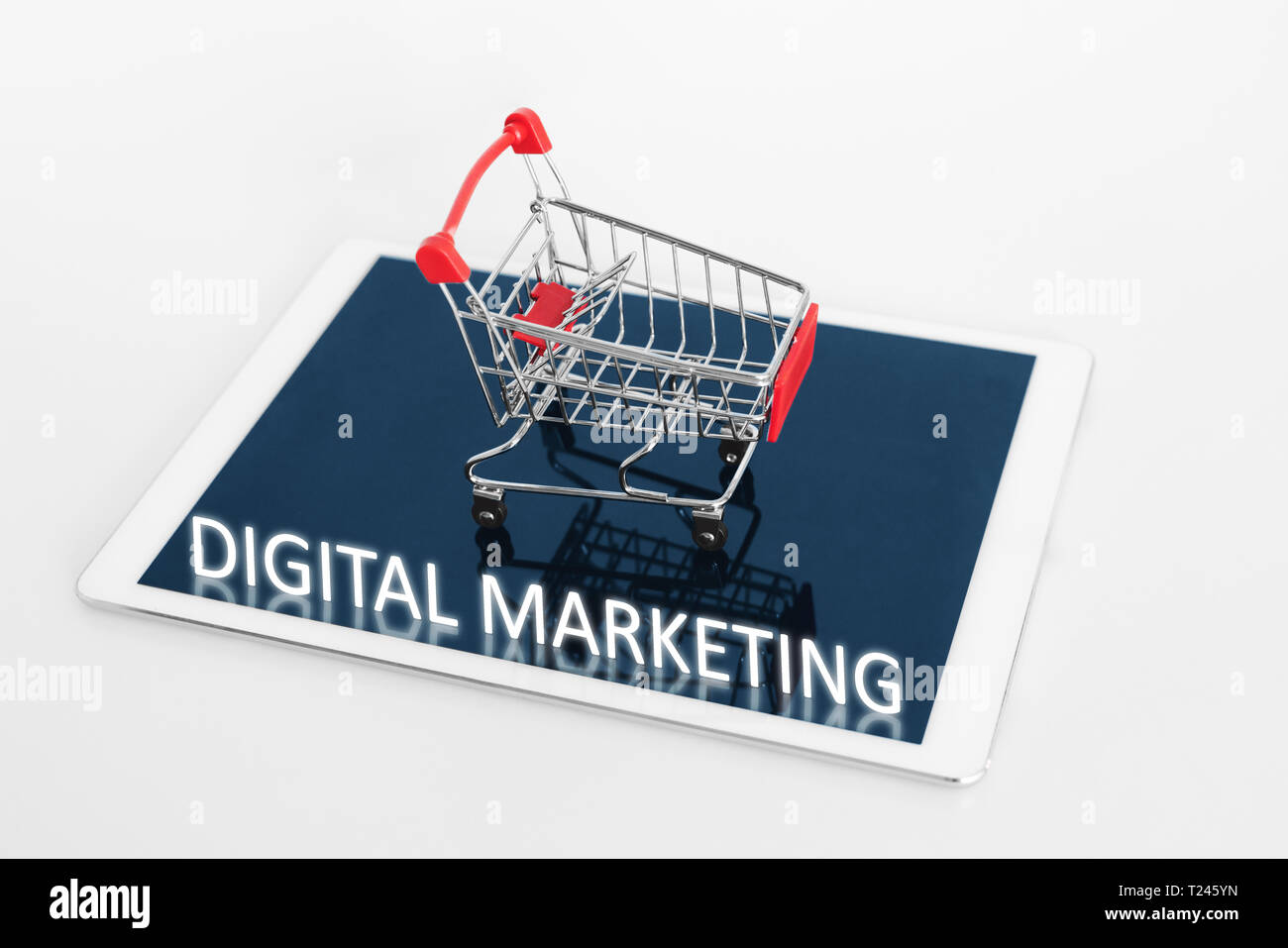 Digital Marketing. Shopping cart on digital tablet, on white background Stock Photo