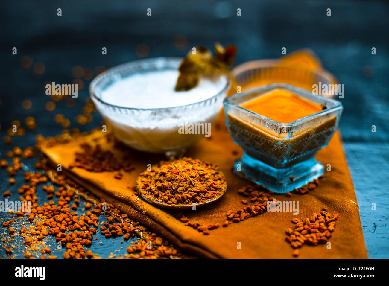 Herbal and organic home remedy for hair fall . Egg white mixed with curd  and fenugreek seeeds in a bowl,On wooden surface with raw fenugreek or met  Stock Photo - Alamy