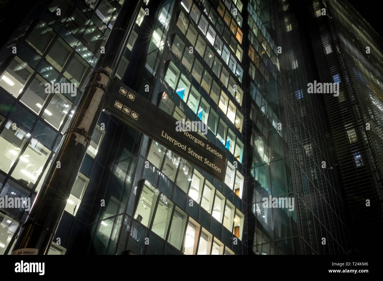 Morgate station and Liverpool street station sign in front of glass building at night. Stock Photo