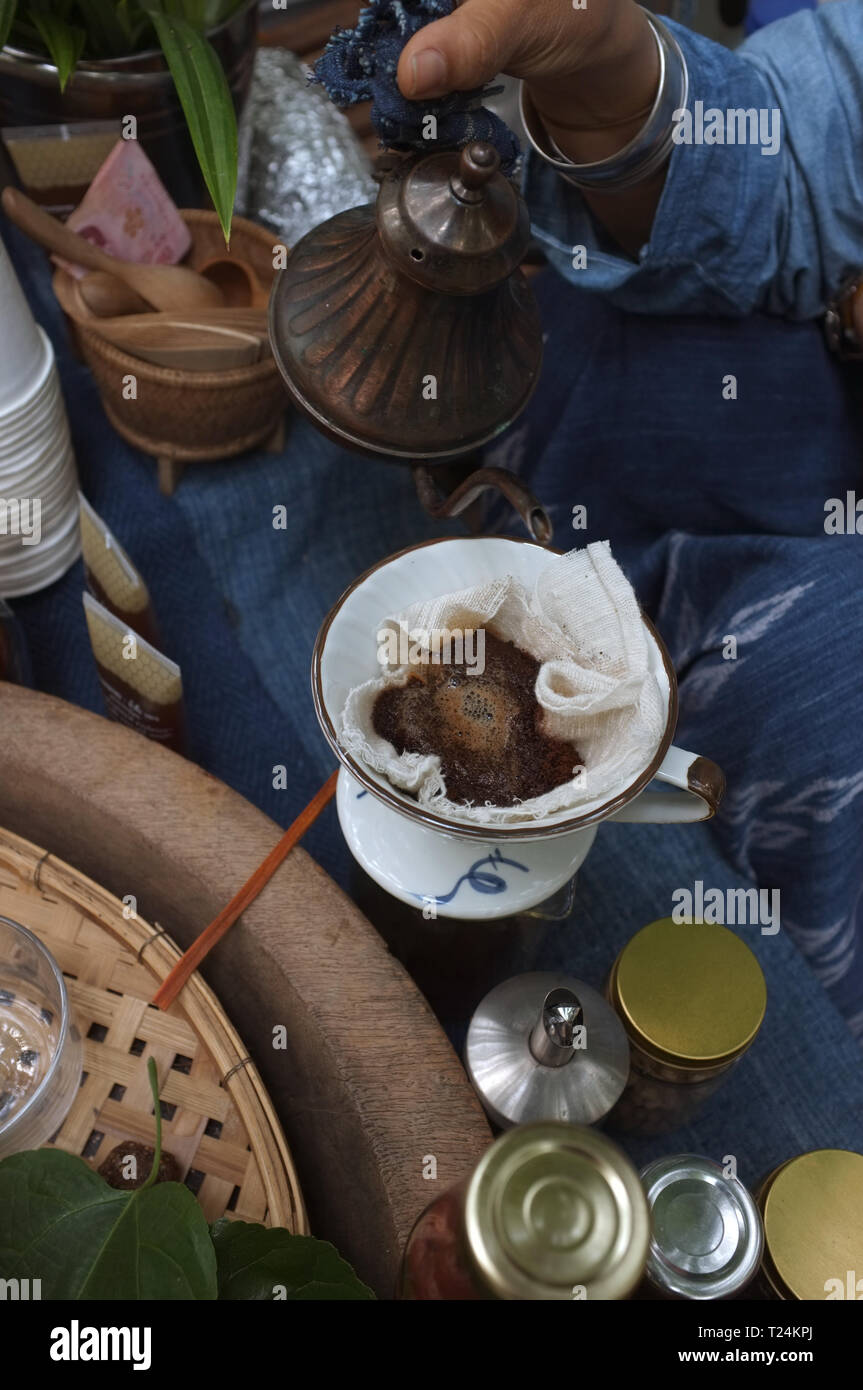The woman making a Brew rice tea . THAI TEA Stock Photo
