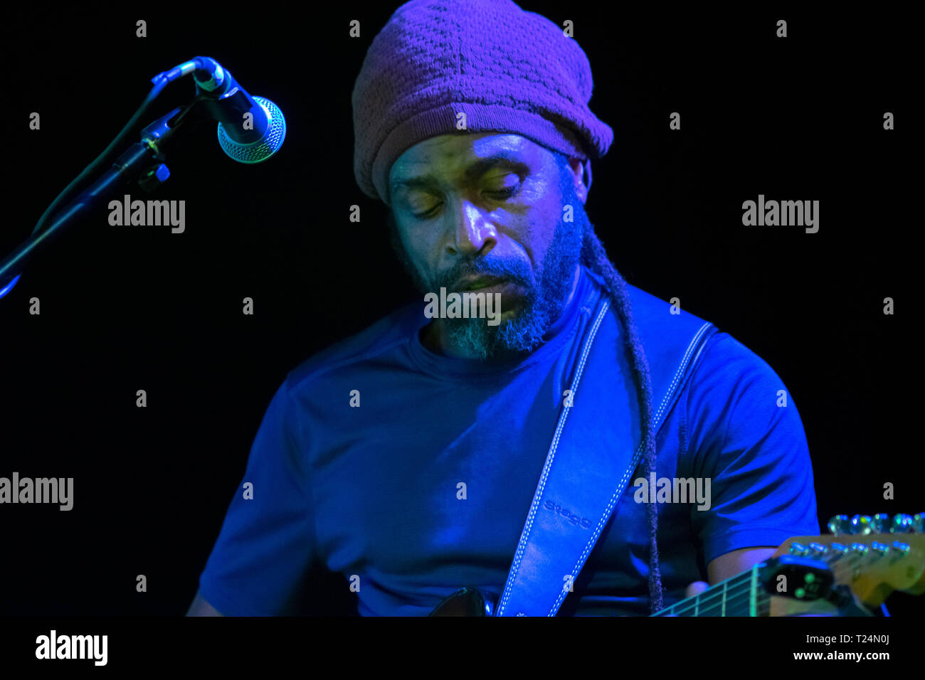Cardiff, UK, March 21, 2019, Junior Jazz the Wailers rhythm guitar player, performing the opening acoustic segment at the Tramshed. Â© Mo Eshak. Stock Photo