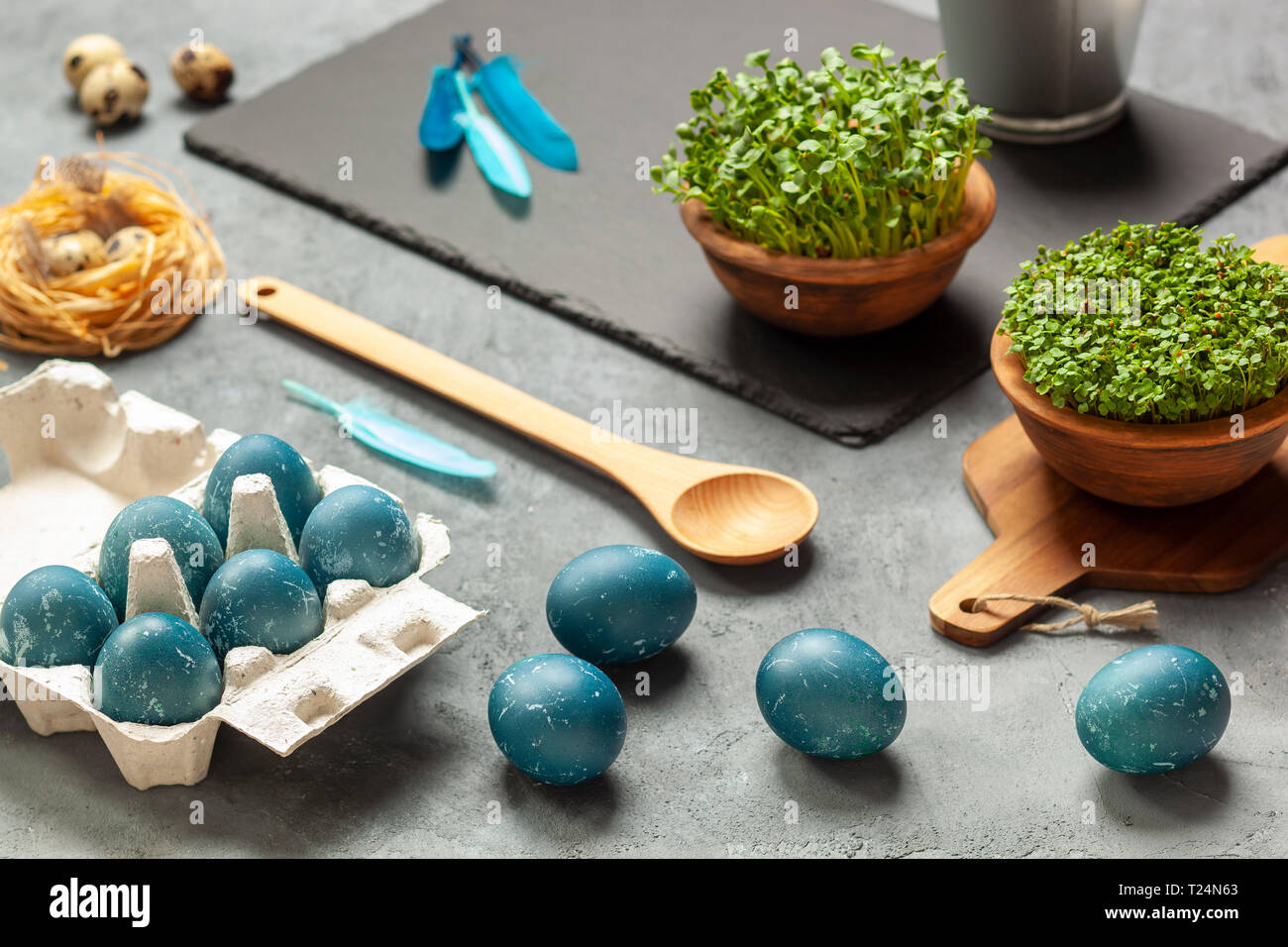 Easter composition - eggs naturally bred in blue with red cabbage Stock Photo