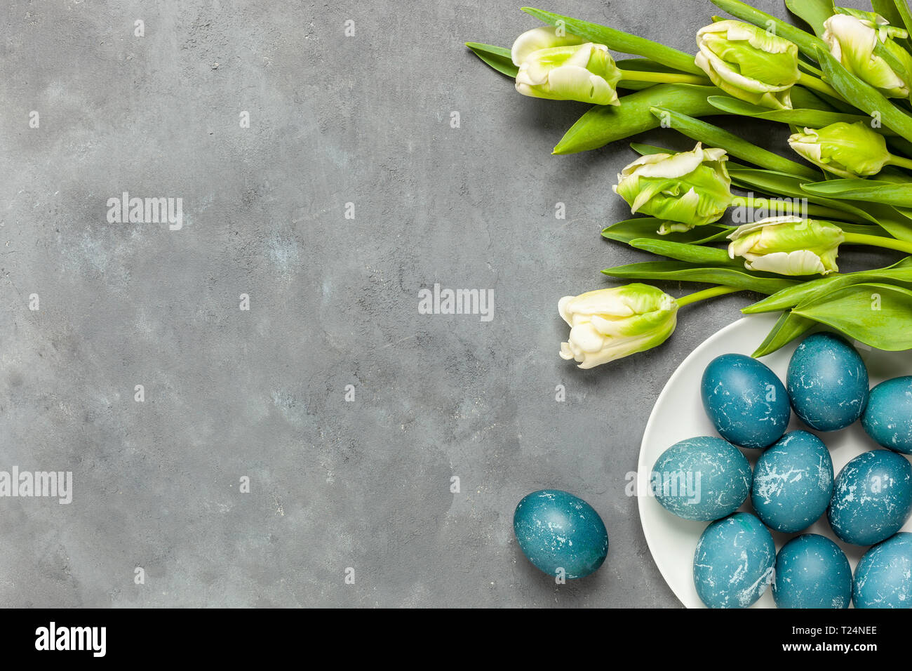 Easter composition on gray textured background with space for text ...