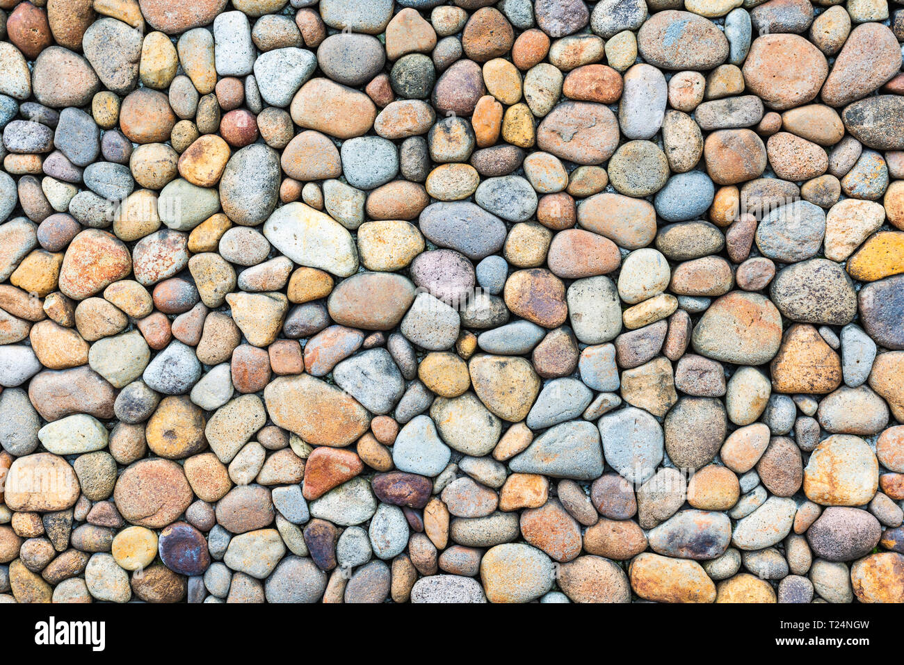 Colorful pebble stone wall texture Stock Photo