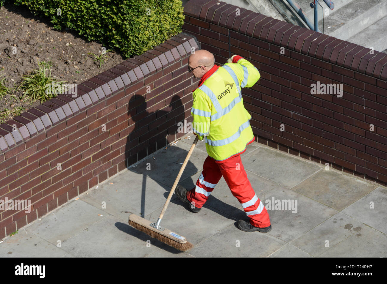 A hard-working and meticulous City of London (Amey) road sweeper on a hot summer's day Stock Photo