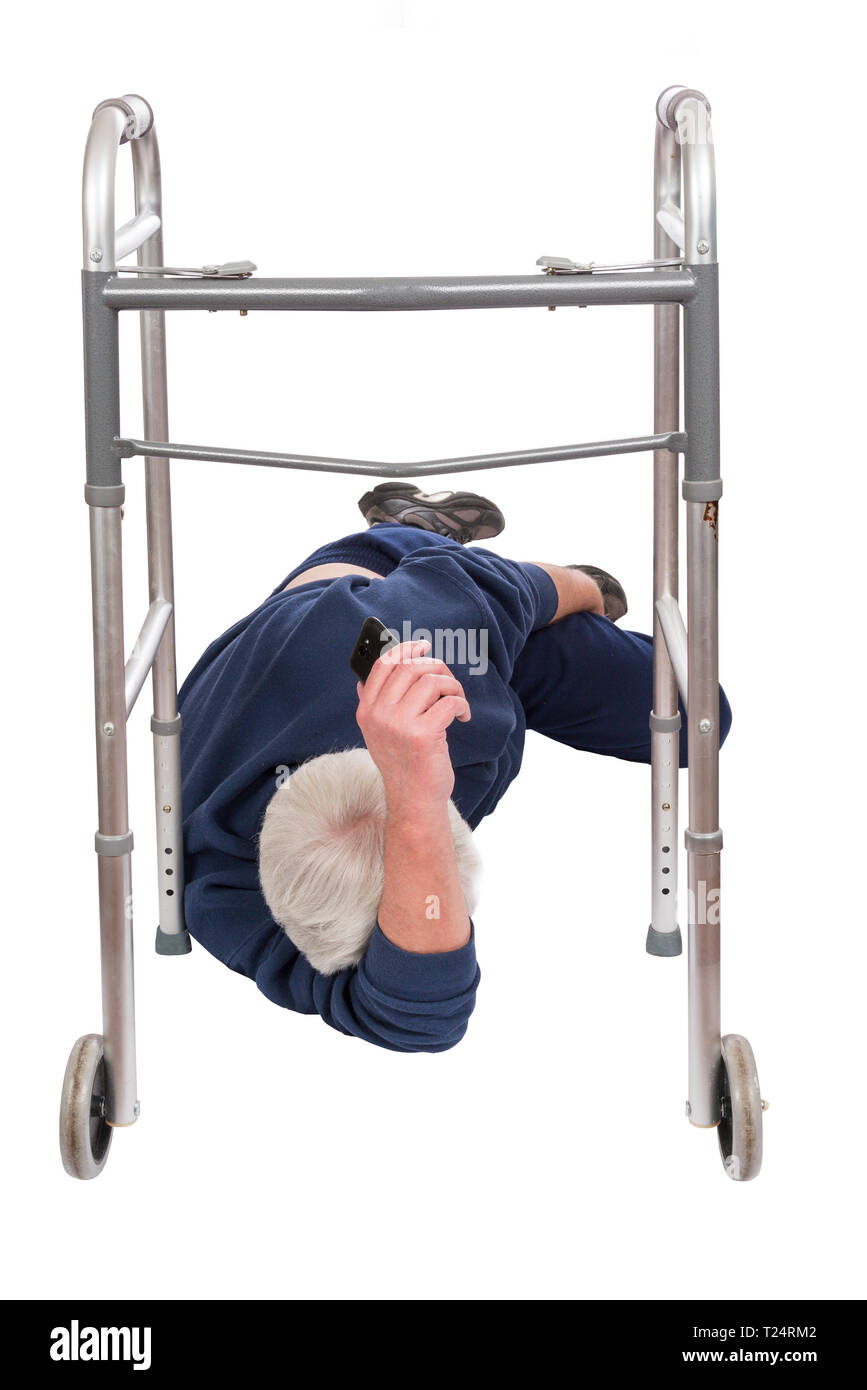 Vertical shot of an elderly man who has fallen down while using his walker isolated on white.  He is laying on his side.  His face cannot be seen. Stock Photo