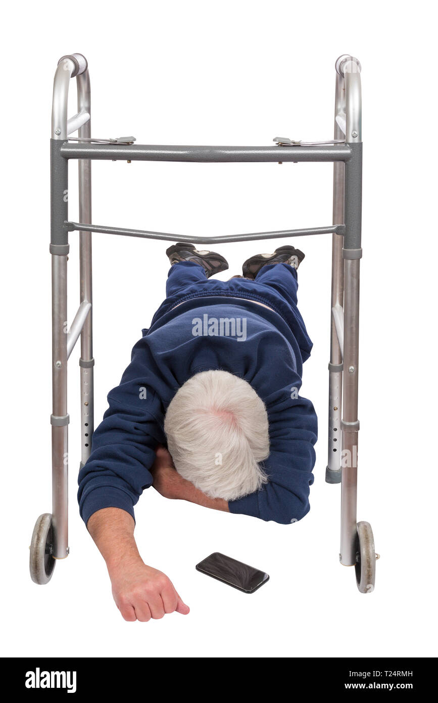 Vertical shot of an old man who has fallen face down from his walker.  Cell phone is on the ground in front of him.  Isolated on white. Stock Photo