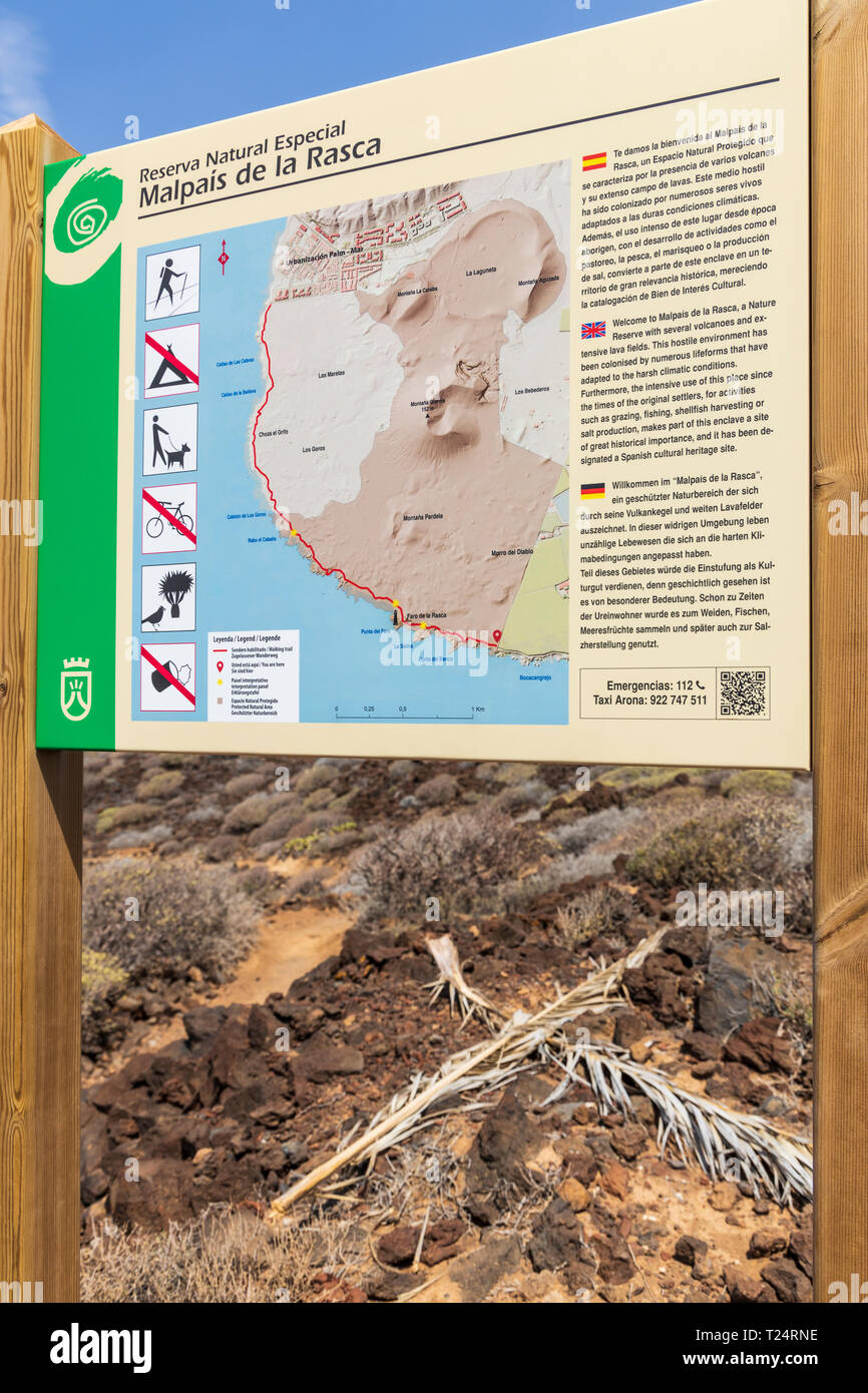 Multilingual information sign with map in the Malpais de la Rasca, Palm Mar, Tenerife, Canary Islands, Spain Stock Photo