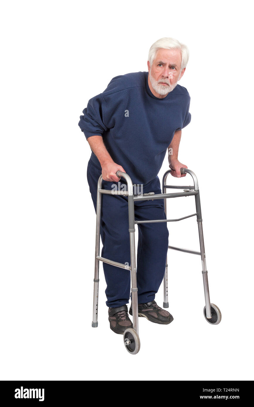 Vertical shot of a suspicious old man with walker isolated on white with copy space. Stock Photo