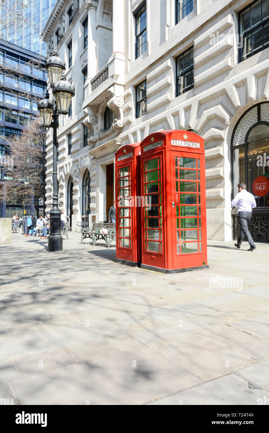 Inoperative Grade II listed red telephone boxes on The Royal Exchange, City of London, UK Stock Photo