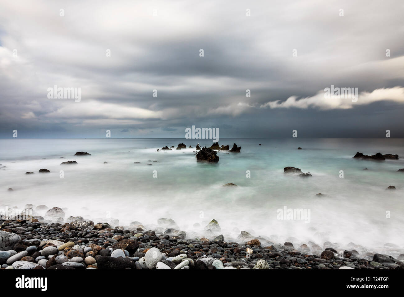 Long exposure seascape with ND filters at dawn on the west coast at Playa San Juan, Tenerife, Canary Islands, Spain Stock Photo