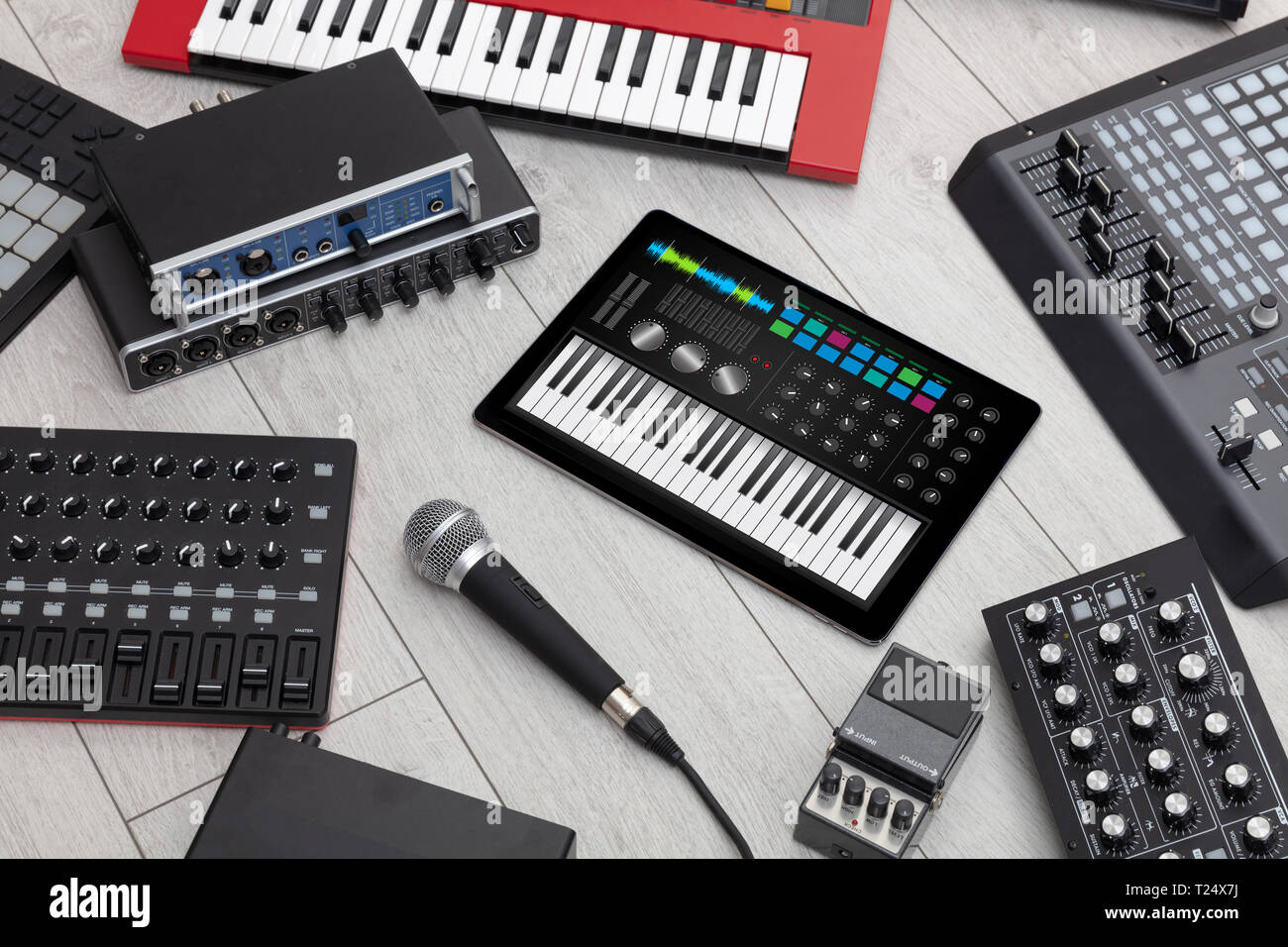 Piano synthesizer app on tablet and musical instrument concept Stock