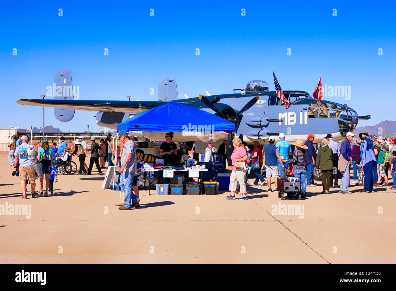 People enjoyng getting up close to a WW2 PBJ1 bomber plane at the