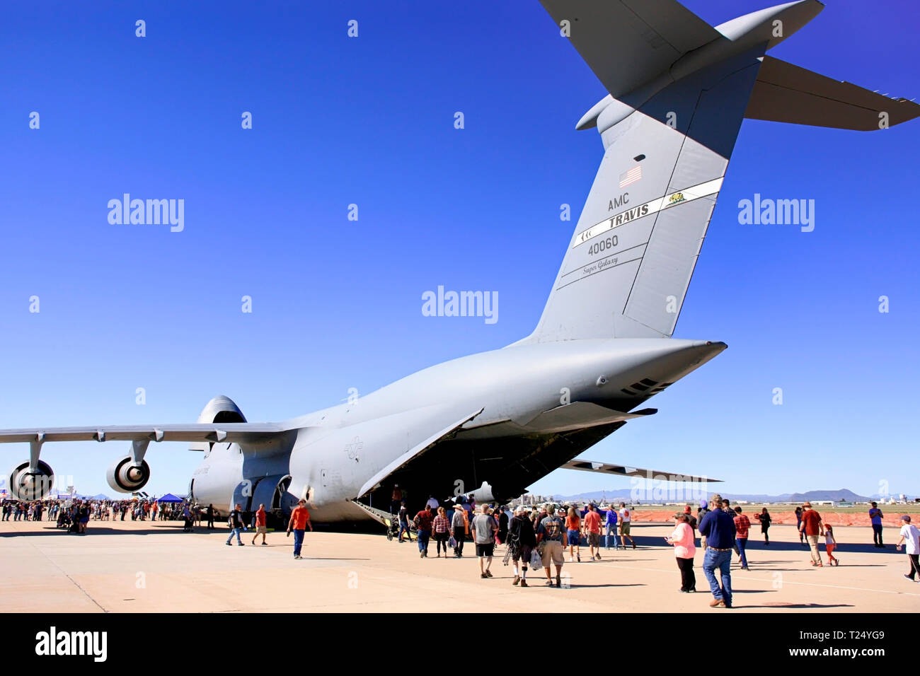 People enjoyng getting up close to a USAF Lockheed C-5 Galaxy heavy cargo plane on display at Davis-Monthan AFB airshow in Tucson AZ Stock Photo