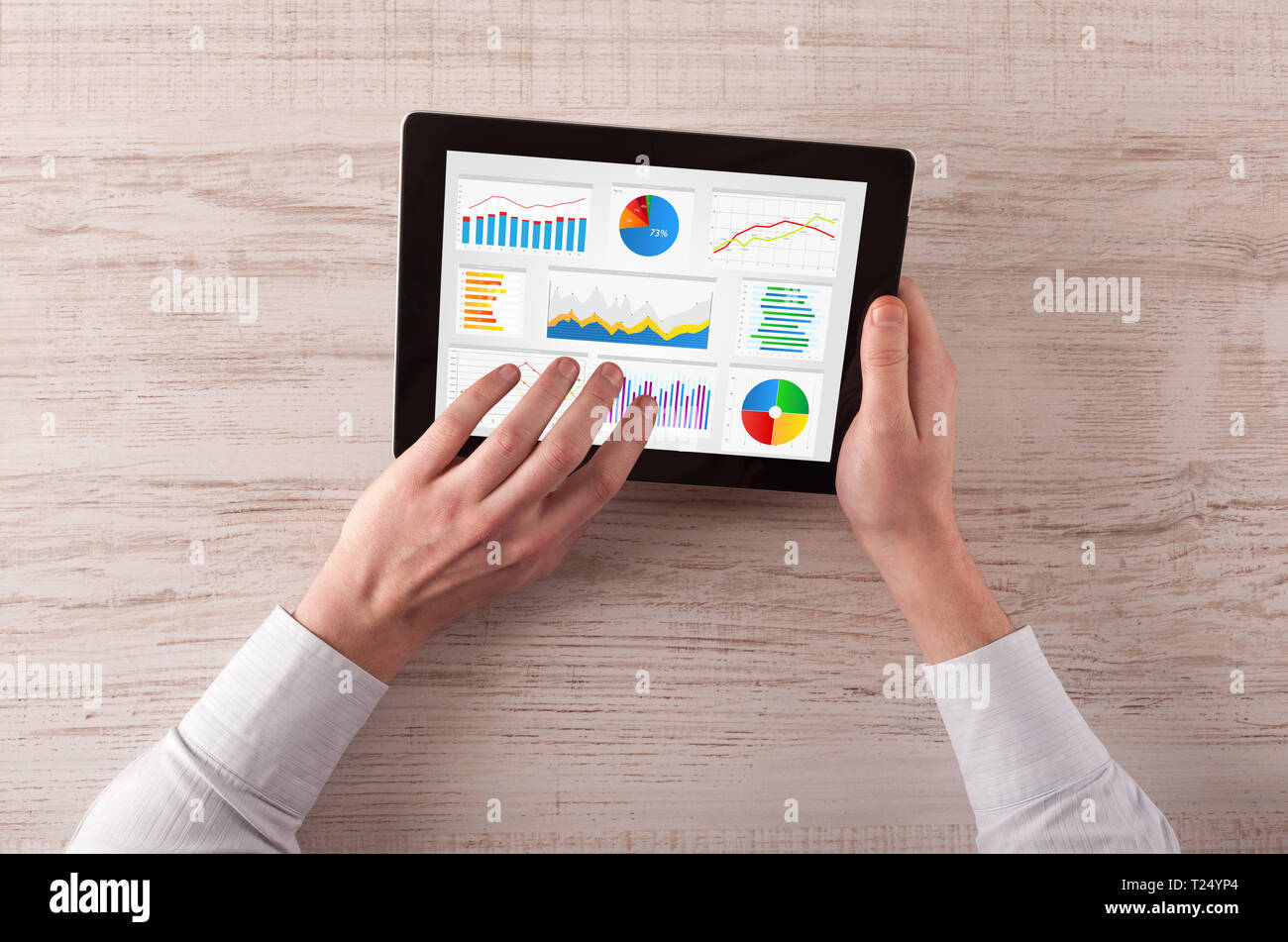 Hand making diagrams and charts on tablet Stock Photo - Alamy