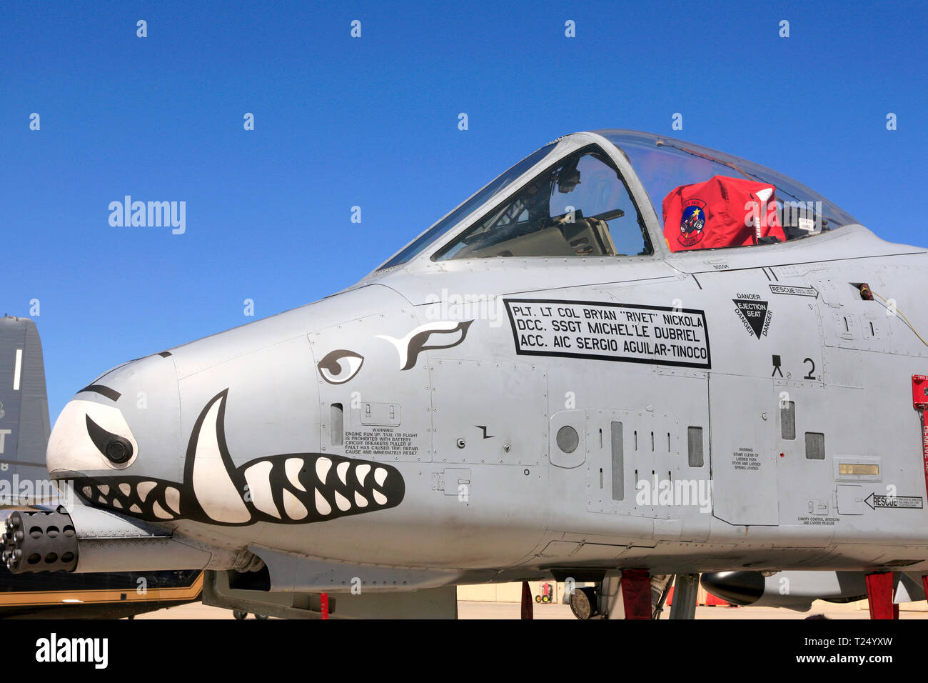 Up close and personal with the sharp end of an A-10 Warthog with its gattling gun and graphics at Davis-Monthan AFB in Tucson AZ Stock Photo