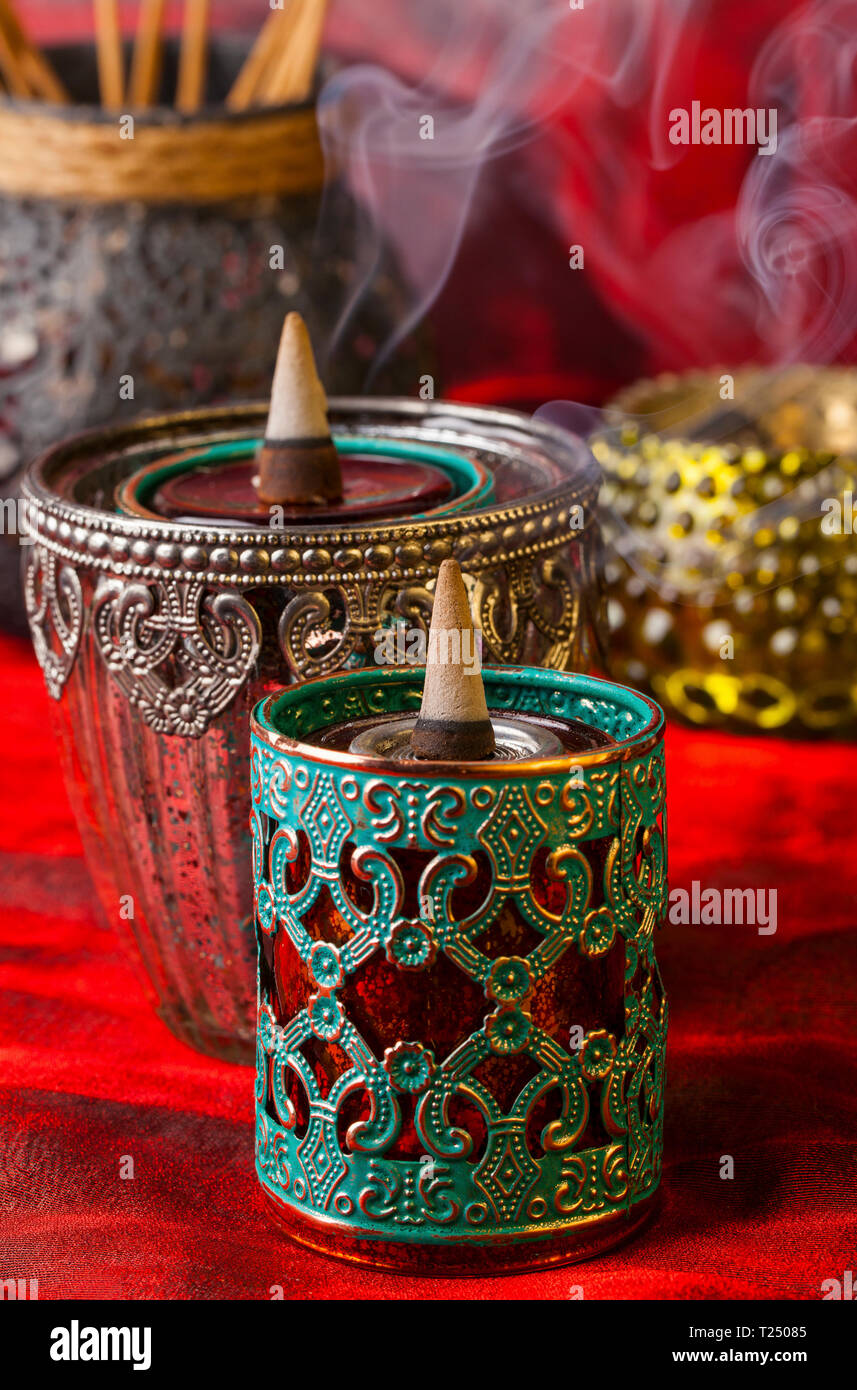 Burning aromatic incense cones Stock Photo