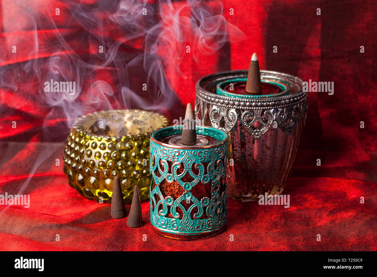 Incense scented smoke cone burning hi-res stock photography and images ...