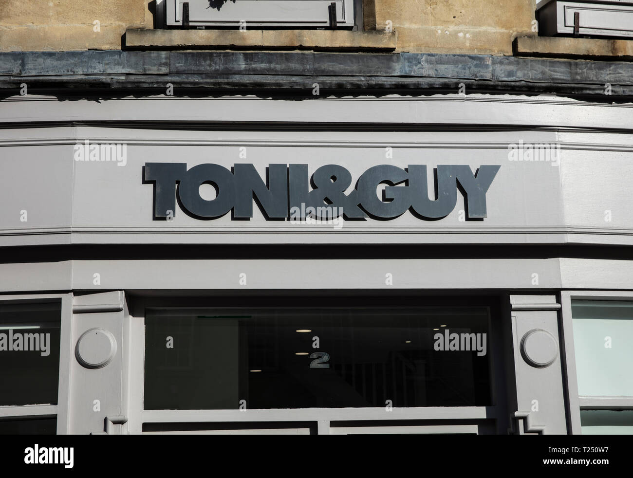 Bath, Somerset, UK, 22nd February 2019, Shop Sign for Toni and Guys Hairdressers Stock Photo