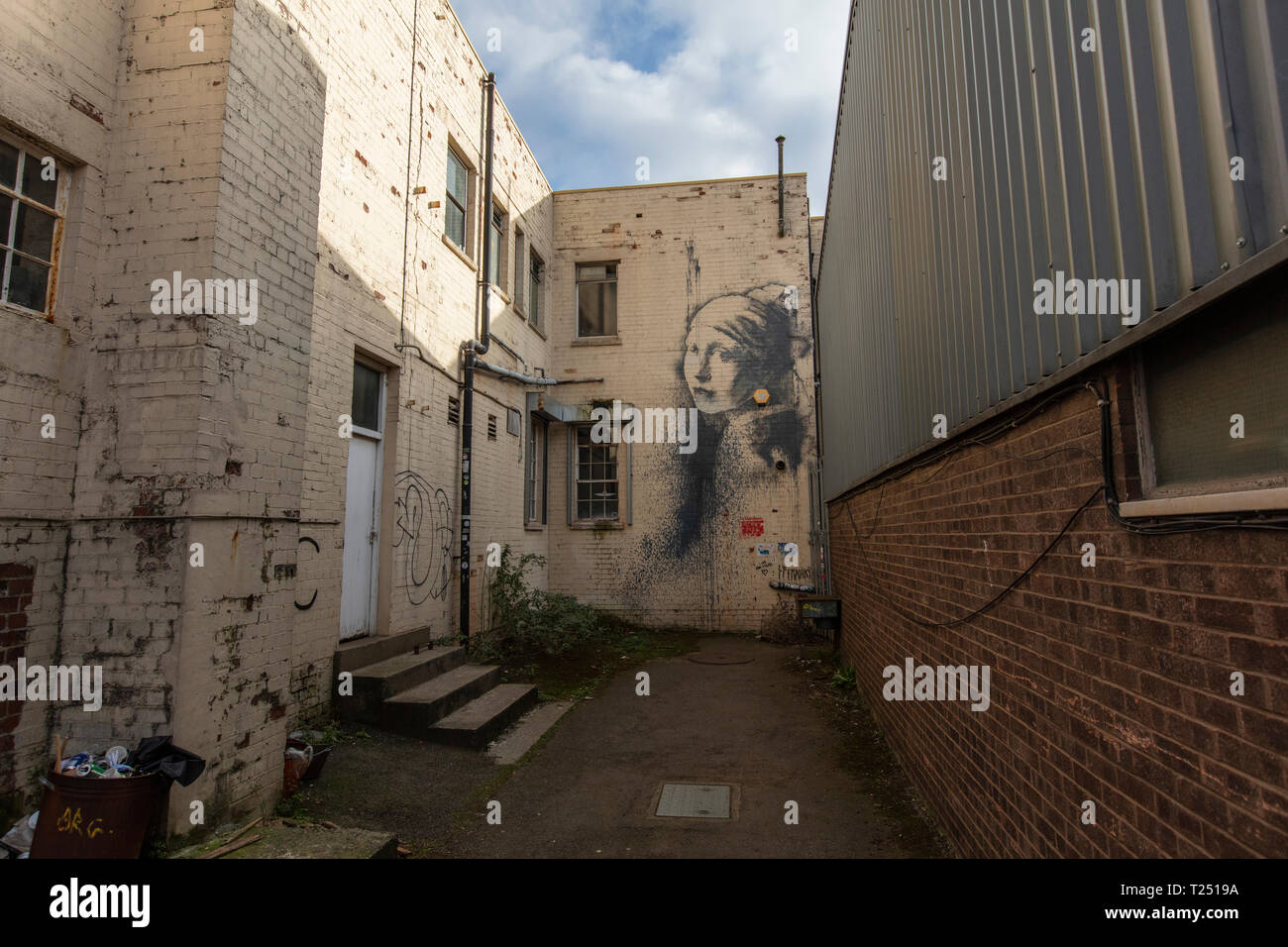 Banksy girl with pierced ear drum hires stock photography and images