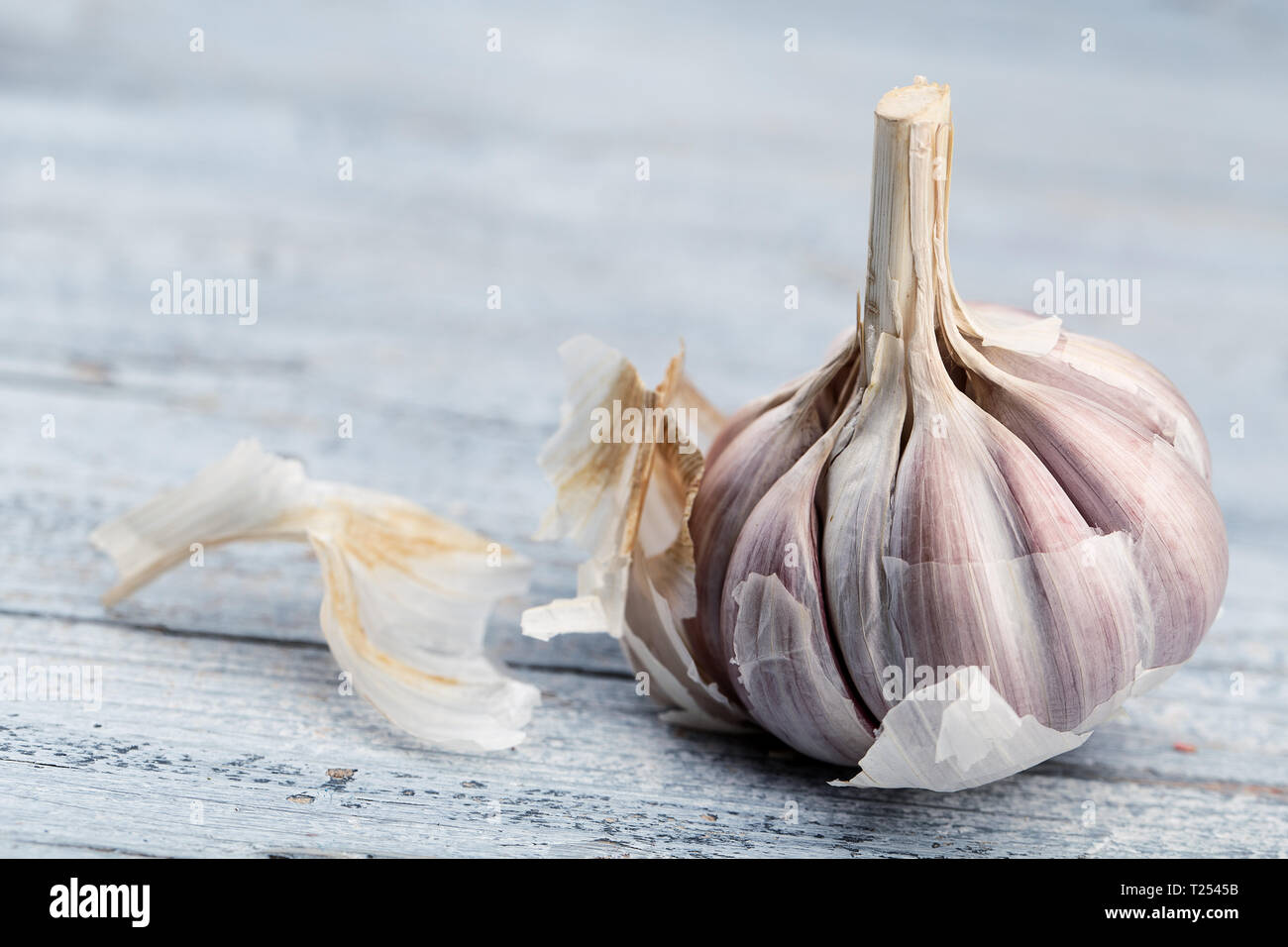 Fresh whole Garlic Bulb on wooden board Stock Photo