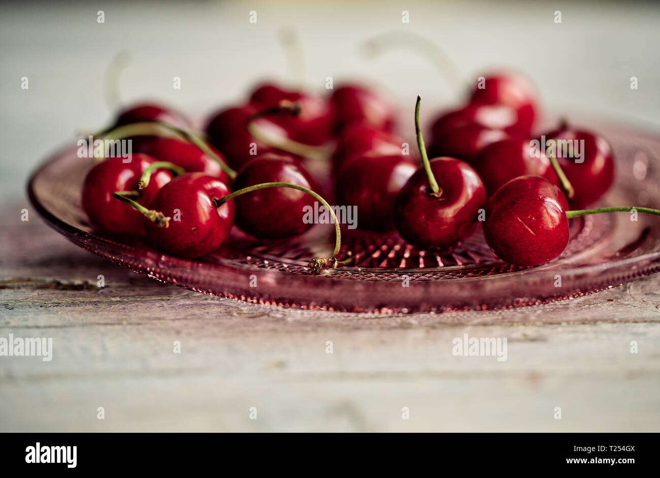 Ripe and bright red sweet cherries Stock Photo