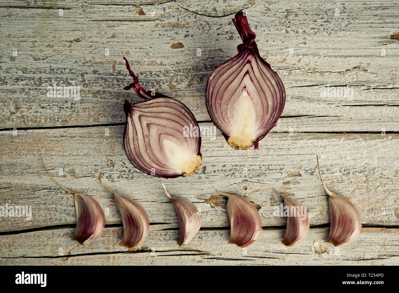 Fresh Garlic Cloves and halved Shallots Stock Photo