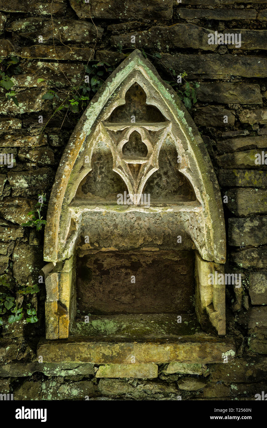 Holy water stoup in a church wall. Stock Photo