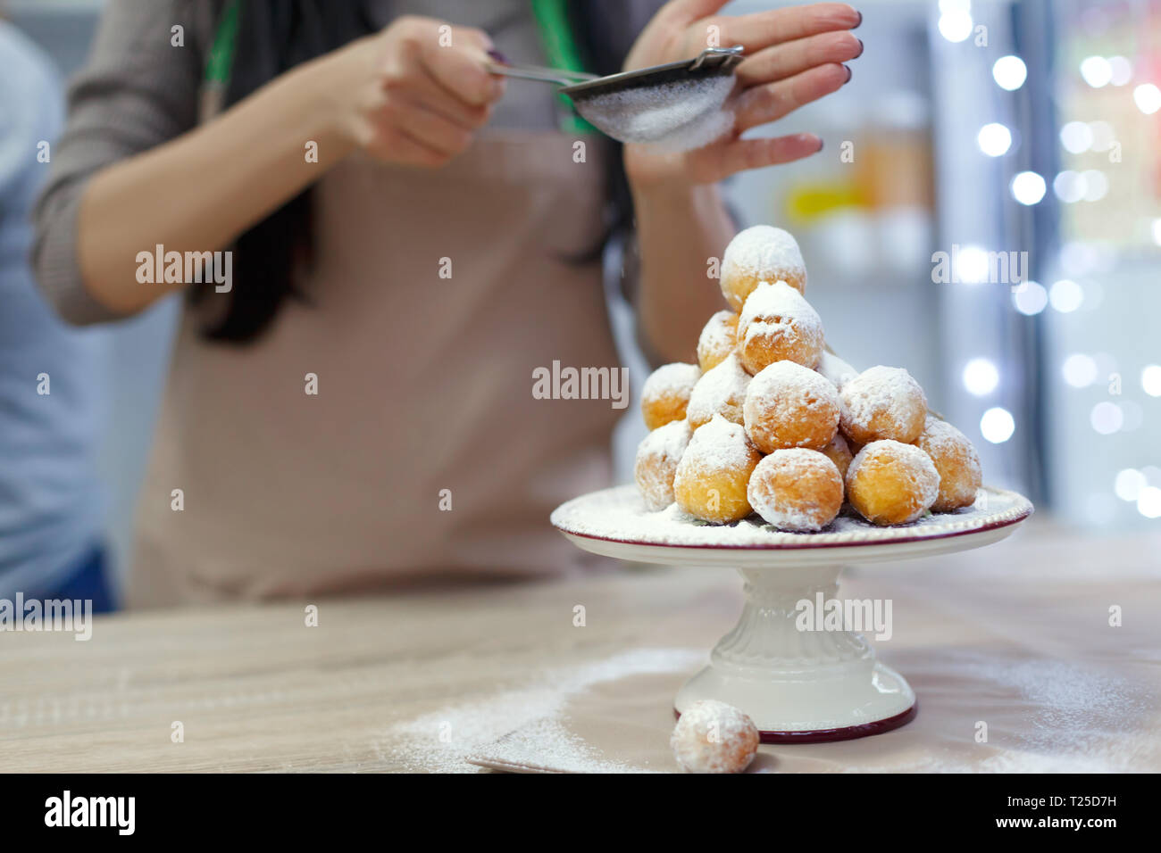 Donuts on a tray sprinkled with powdered sugar. Stock Photo