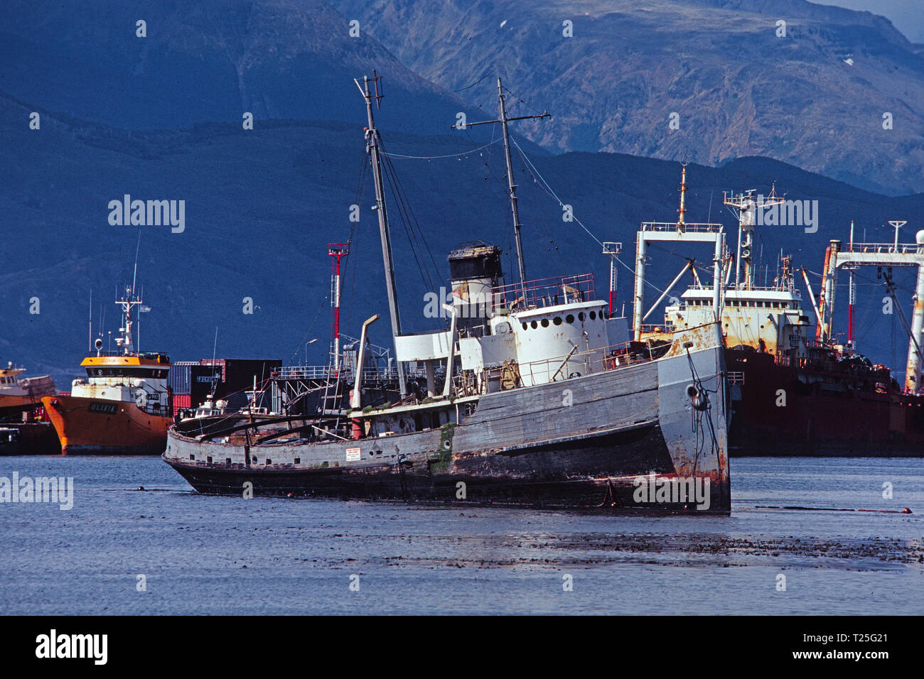 Dilapitated old wooden boat at Ushuaia harbor, Ushuaia, Tierra del Fuego, Patagonia, Argentina Stock Photo