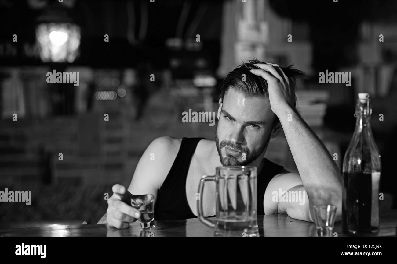 Drinking alcohol may help him relax. Alcohol addict with short alcohol