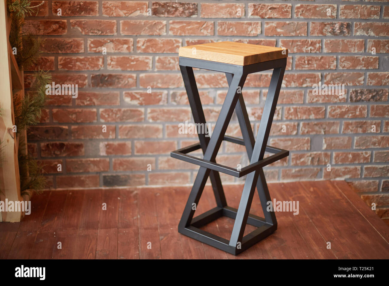 stylish bar stool on brick wall background. photo with copy space Stock