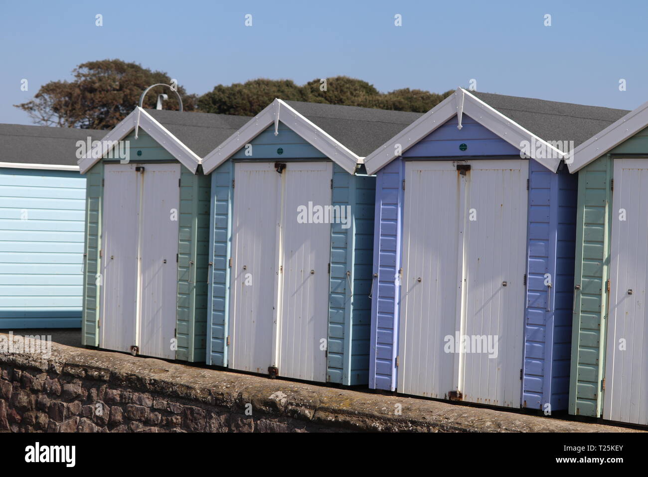 Beach huts WestonsuperMare English coastline. Pastel shades of wooden