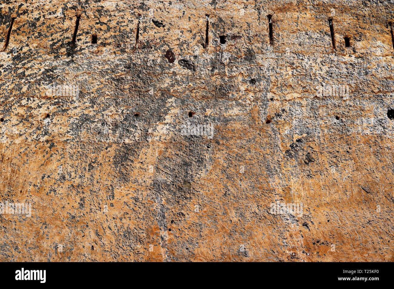 Interesting close up structures of cement and sand stone walls in high ...