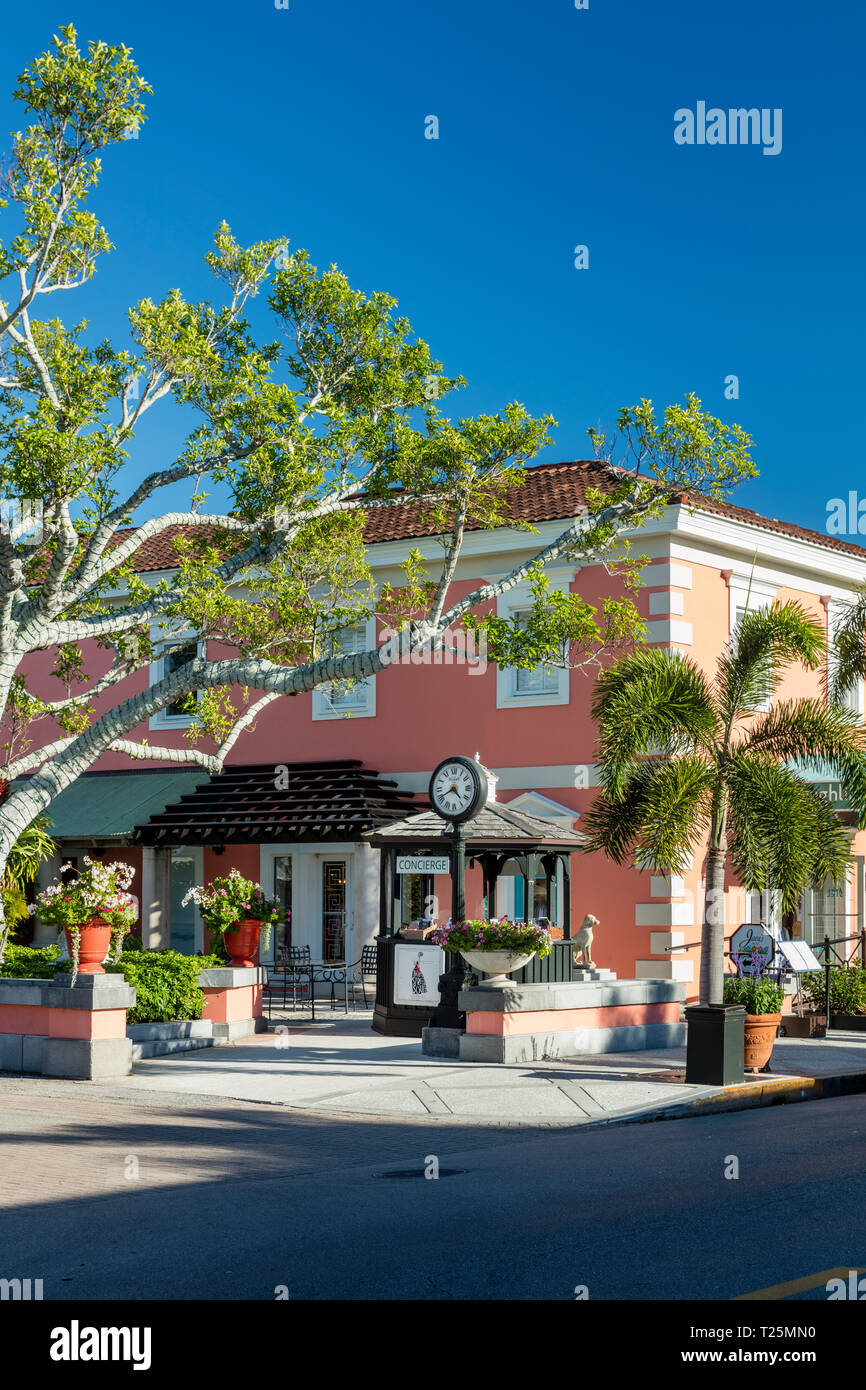 Coral colored building with shops and boutiques along trendy 3rd Street Shopping District, Naples, Florida, USA Stock Photo