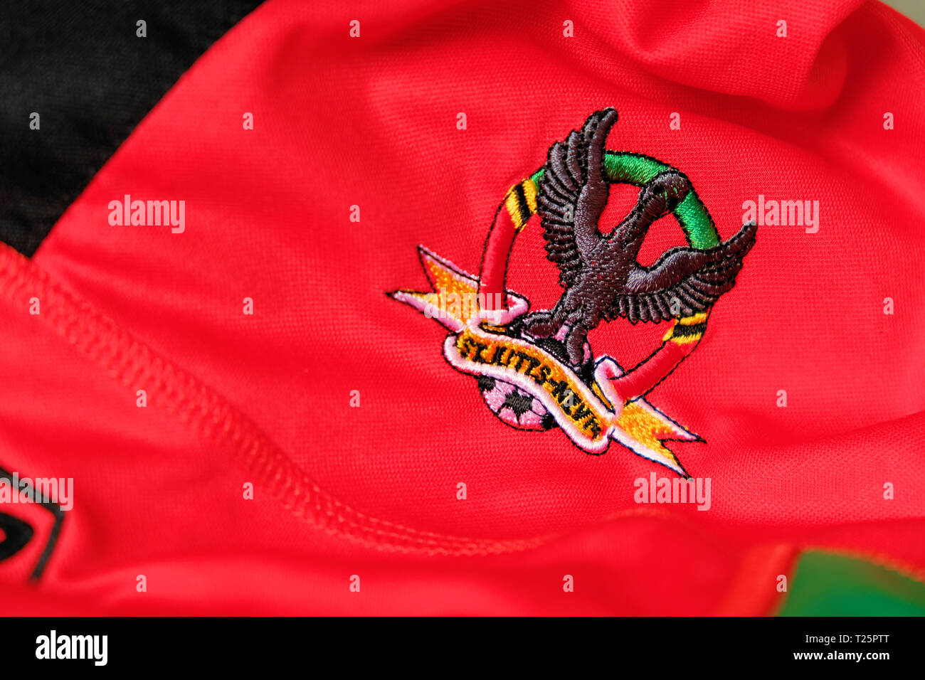 Logo on national soccer team jersey for the Saint Kitts and Nevis national  football team; St. Kitts & Nevis national team kit Stock Photo - Alamy