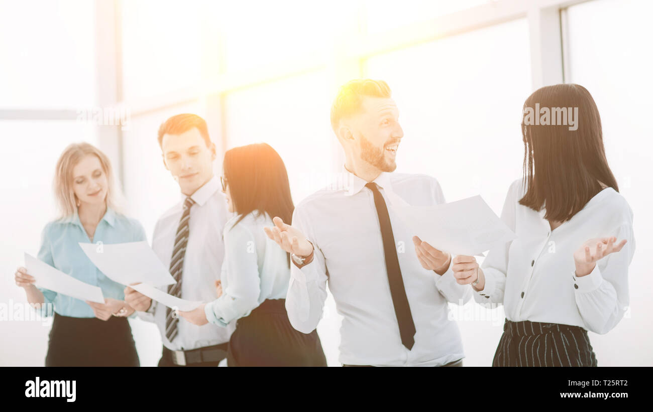 group of employees standing in the office hallway Stock Photo - Alamy