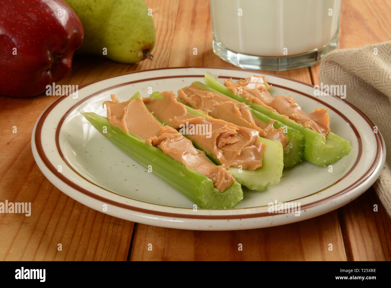 Celery sticks stuffed with organic creamy peanut butter Stock Photo Alamy