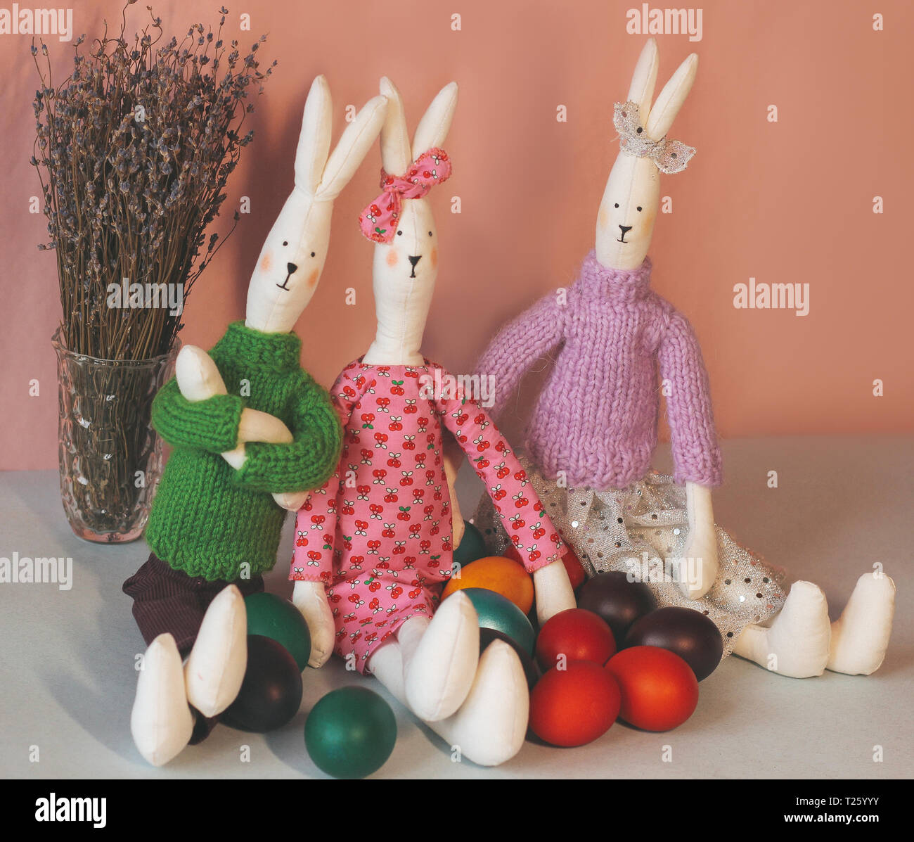 Two Easter bunny with colorful painted eggs. Stock Photo