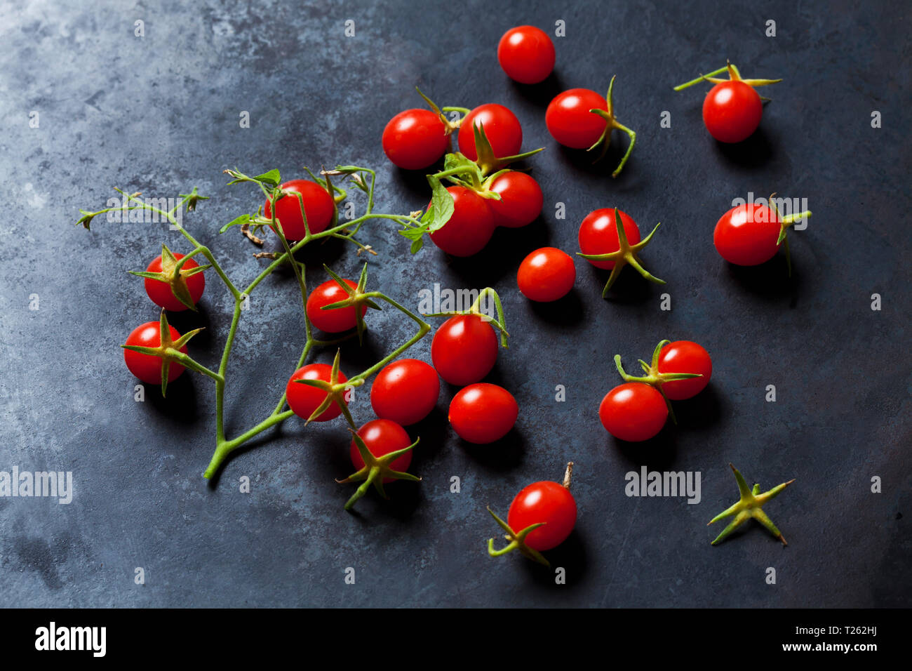 Currant tomatoes on dark ground Stock Photo