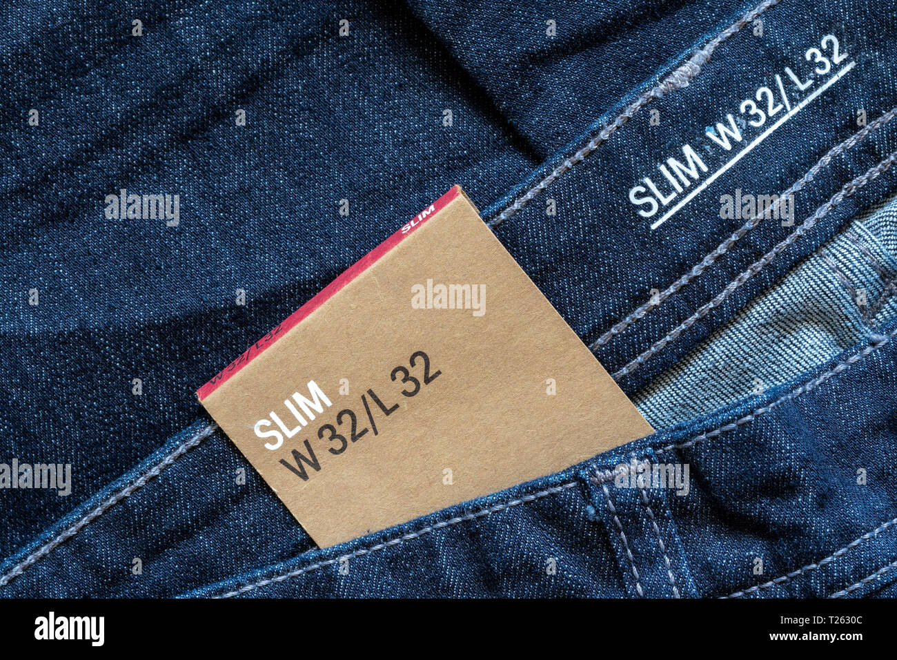 Blank Size Tag on Jeans Waist Stock Photo - Alamy