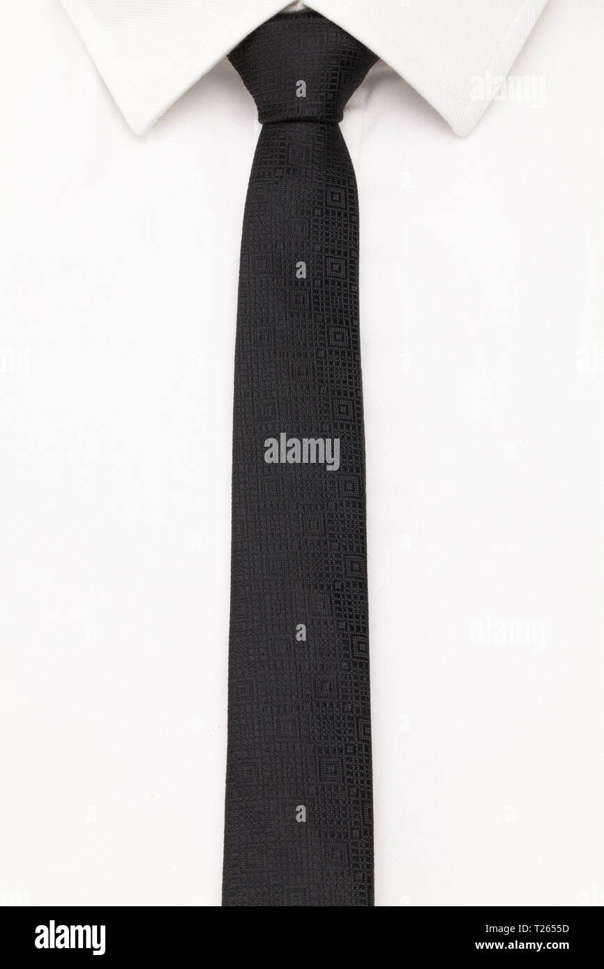 The detail of white shirt and black tie. White classic shirt and black